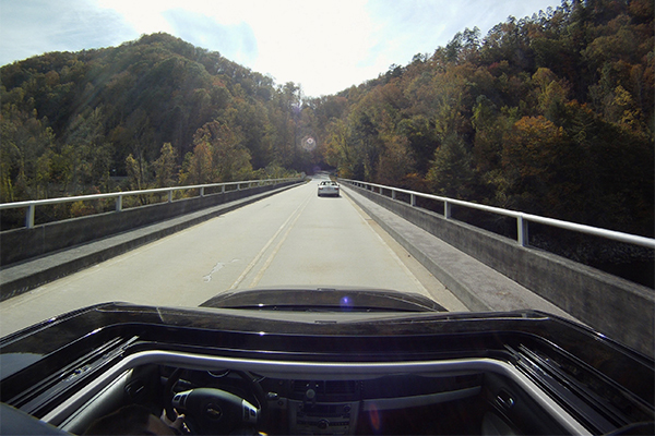 view of road from an open sunroof
