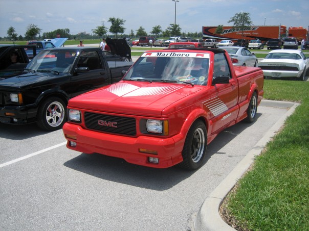 a red Syclone with Marlboro decals in a parking lot