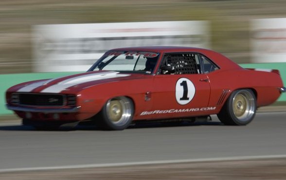 Pro-Touring Big Red Camaro on a track