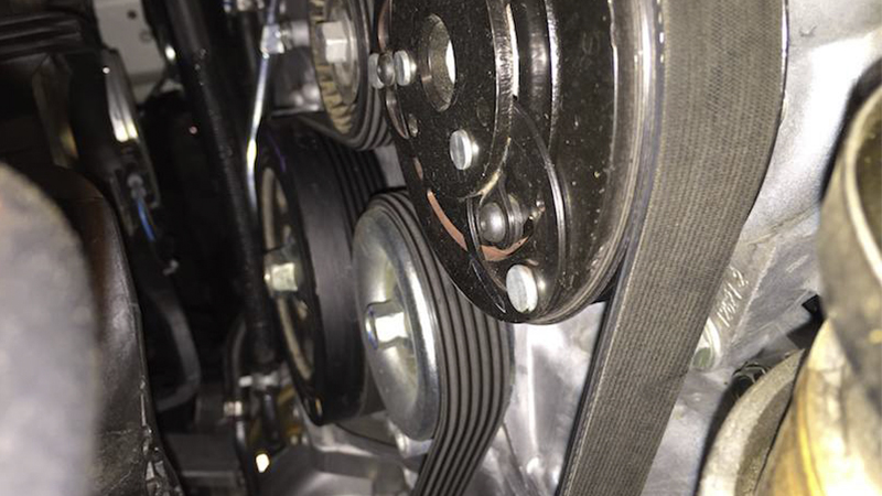 a serpentine belt shown routed on the pulleys 