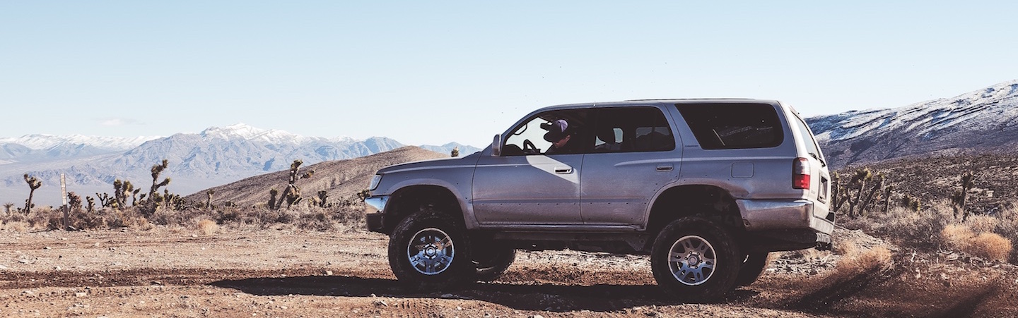 SUV in the desert Source | NeONBRAND/Unsplash