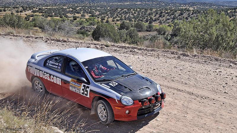 a rally car on a dirt track at a NASA RallySport series