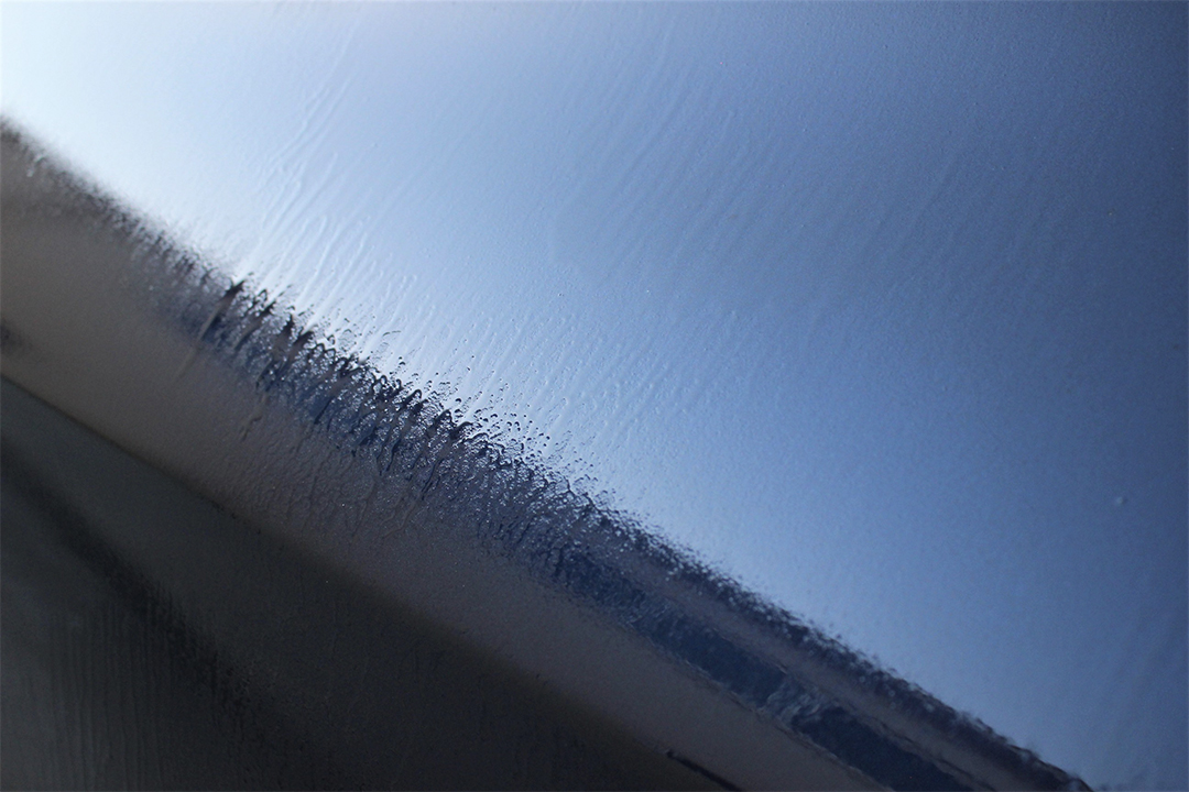 side view of a black vehicle just sprayed with 303 Graphene Nano Spray