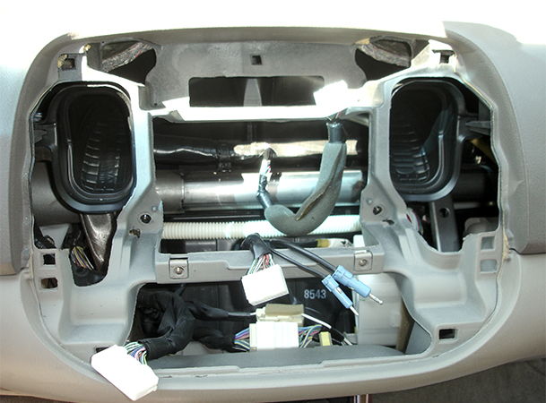 a Camry dashboard with the head unit and trim work removed