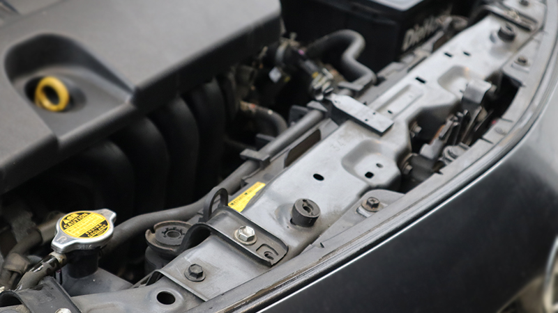 an image of the front of an engine compartment, showing that the view of the radiator is often obscured by other components