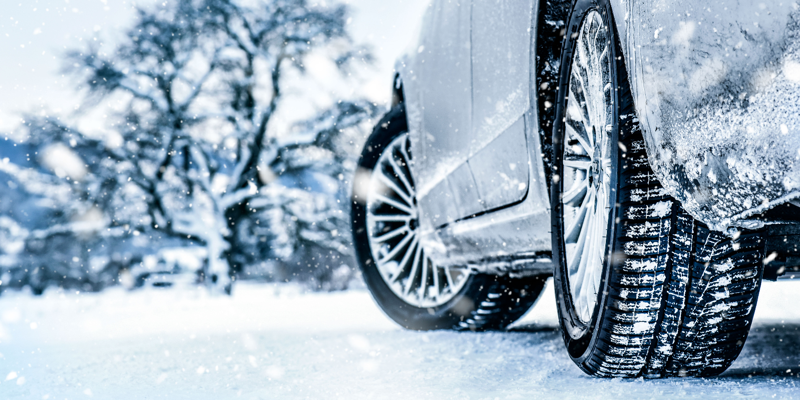 Car tires driving in snow