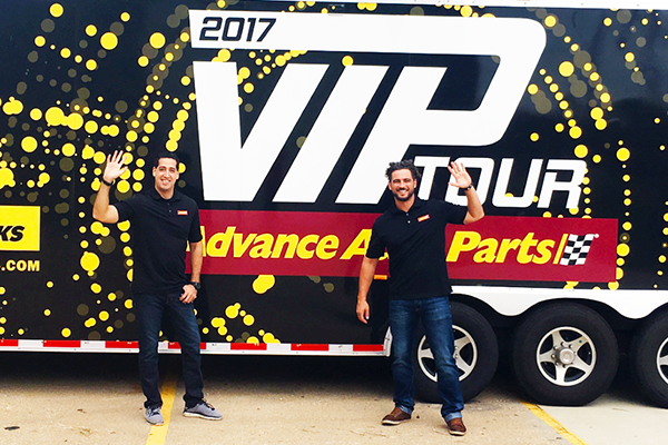 Manny and Carlos in front of VIP Tour Trailer