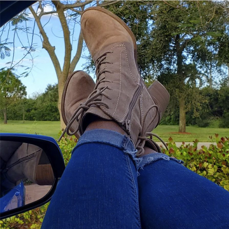 Woman's boots in a truck window, relaxing