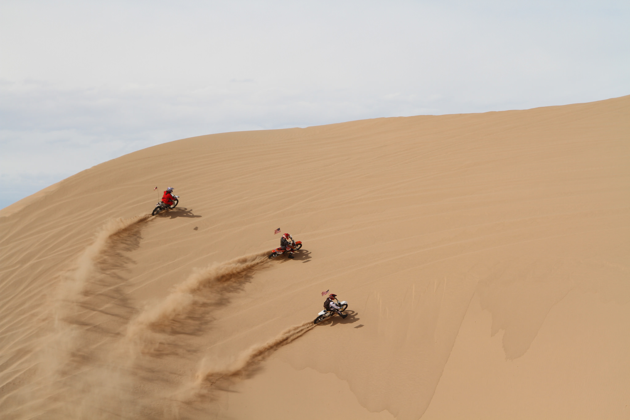 Dirt bikes on a sand dune