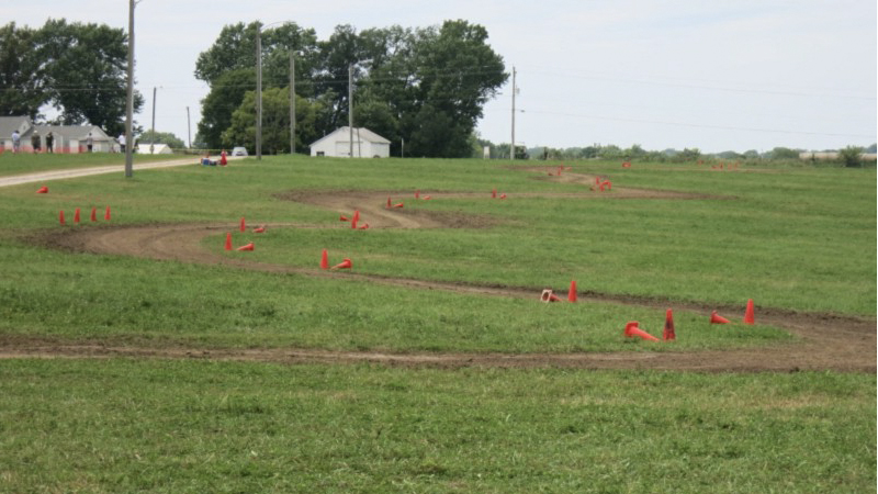 a typical rallycross track at the grassroots level, with a dirt path marked by cones