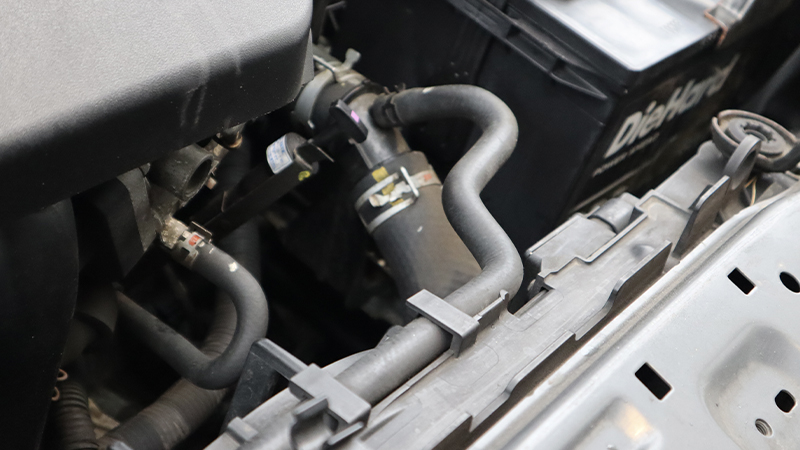 an upper radiator hose in the engine compartment