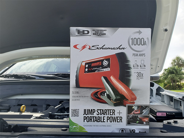 boxed jump starter on an open engine bay