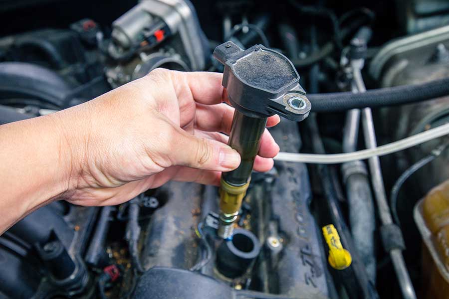 ignition coils under the hood of a vehicle
