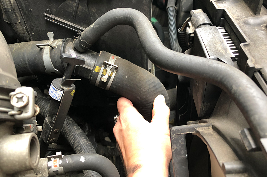 touching upper radiator hose