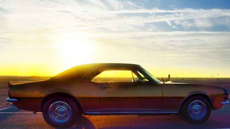 vintage camaro in sunset